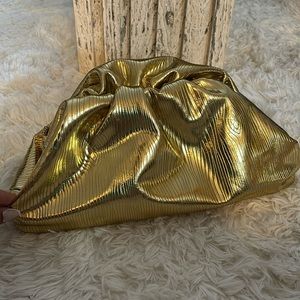 Large gold dumpling style clutch bag